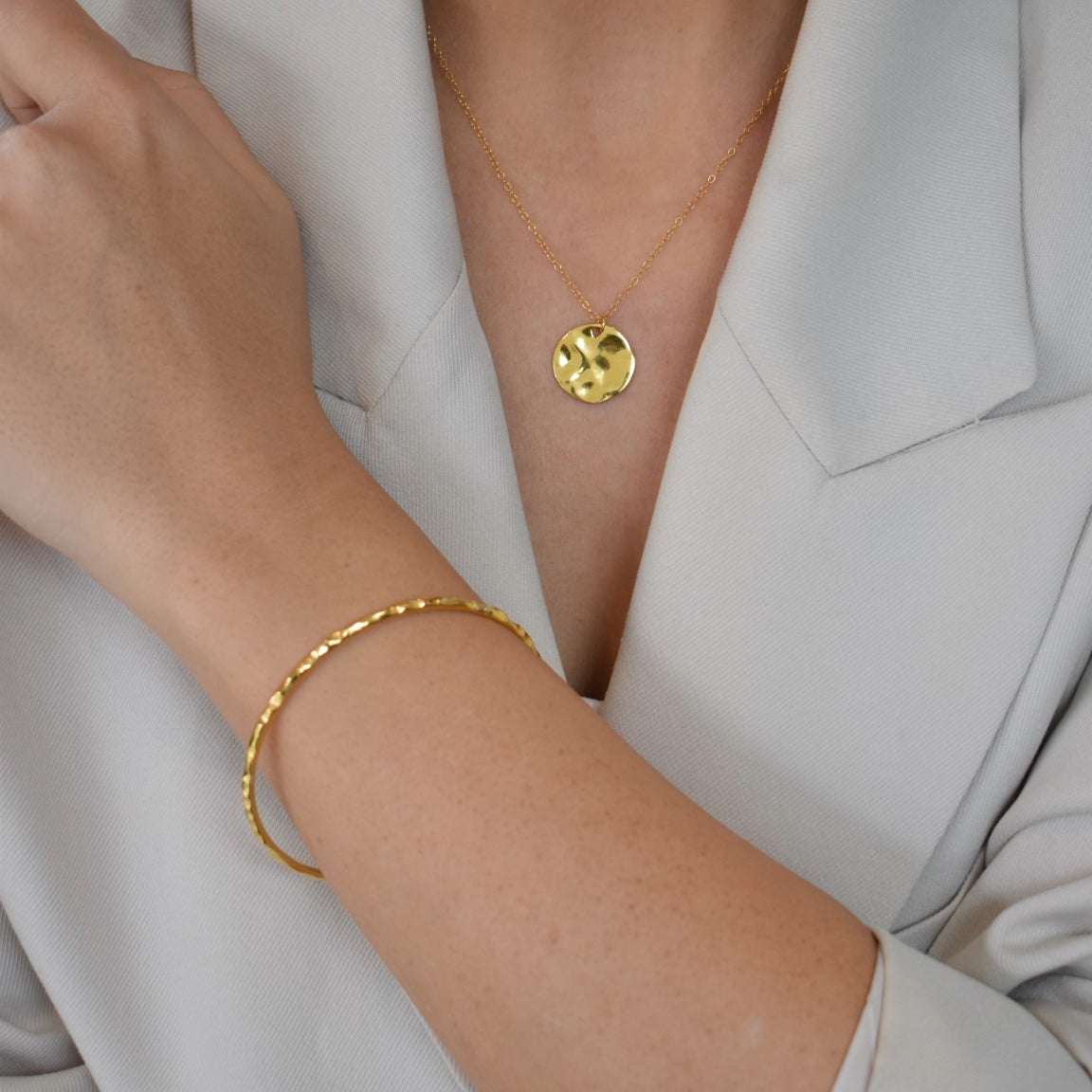 gold hammered pendant necklace and gold hammered bangle