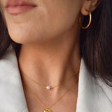 Angled Hoop Earrings with a softly sculpted organic silhouette, available in sterling silver, gold vermeil and rose gold vermeil.