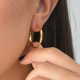 Angled Hoop Earrings with a softly sculpted organic silhouette, available in sterling silver, gold vermeil and rose gold vermeil.