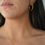 Angled Hoop Earrings with a softly sculpted organic silhouette, available in sterling silver, gold vermeil and rose gold vermeil.