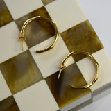 Angled Hoop Earrings with a softly sculpted organic silhouette, available in sterling silver, gold vermeil and rose gold vermeil.