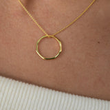Gold vermeil angled hoop pendant necklace with a modern circular pendant on a delicate chain.
