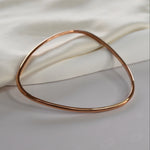 Signature Bangle with a softly sculpted organic silhouette, available in sterling silver, gold vermeil and rose gold vermeil.