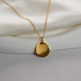 Disc Pendant Necklace with a polished round pendant, available in sterling silver, gold vermeil and rose gold vermeil.