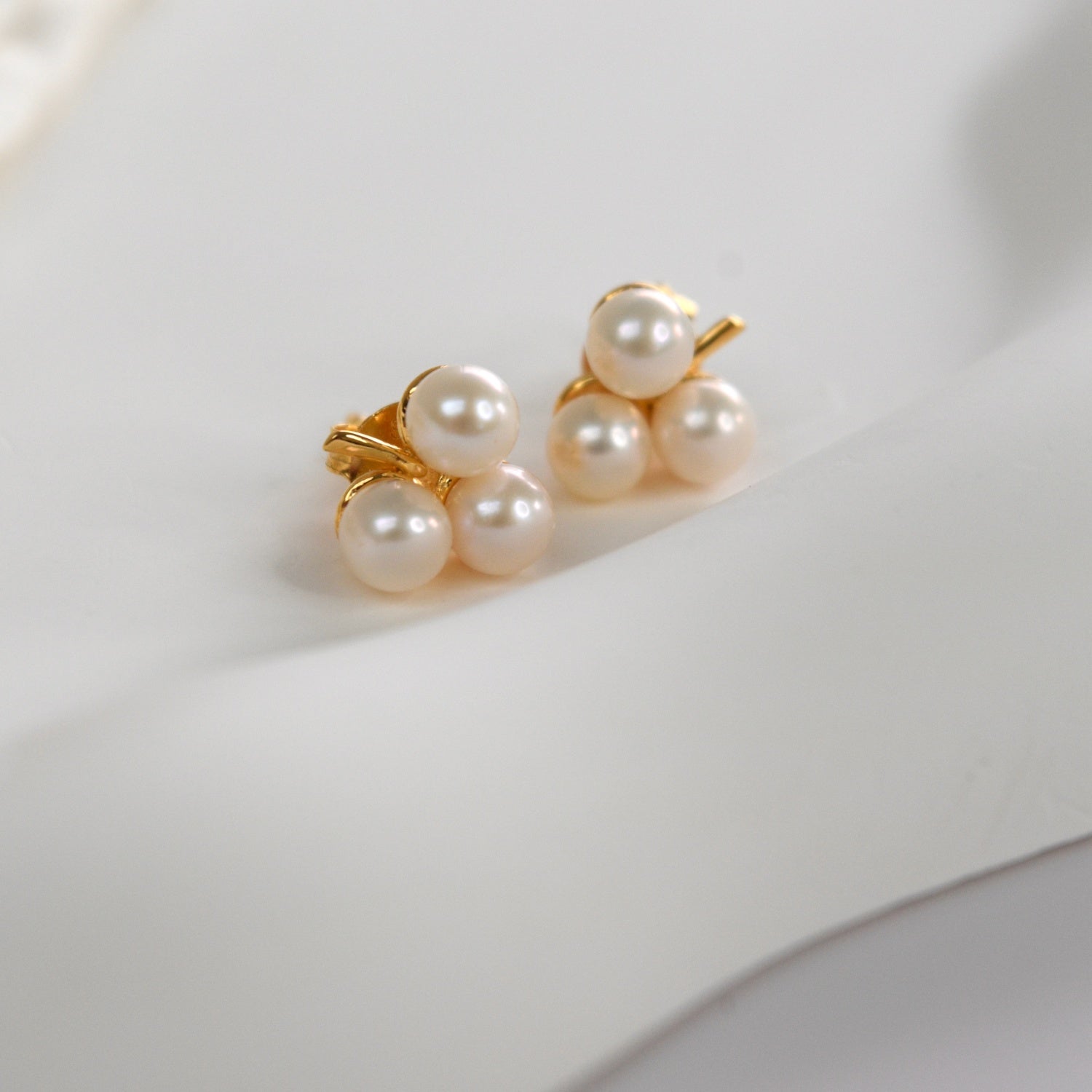 Freshwater Pearl Clover Stud Earrings with three cultured pearls in a delicate clover design.