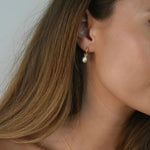 Freshwater Pearl Drop Huggie Earrings with removable cultured freshwater pearl drops.