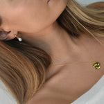 Freshwater Pearl Drop Huggie Earrings with removable cultured freshwater pearl drops.