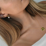 Freshwater Pearl Drop Huggie Earrings with removable cultured freshwater pearl drops.