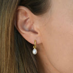 Freshwater Pearl Drop Huggie Earrings with removable cultured freshwater pearl drops.