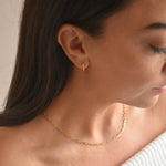 Gold vermeil paperclip chain necklace worn by a model in side profile, showing how the chain sits around the neck.