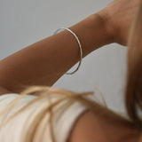 Hammered Bangle with an organic textured finish, available in sterling silver, gold vermeil and rose gold vermeil.