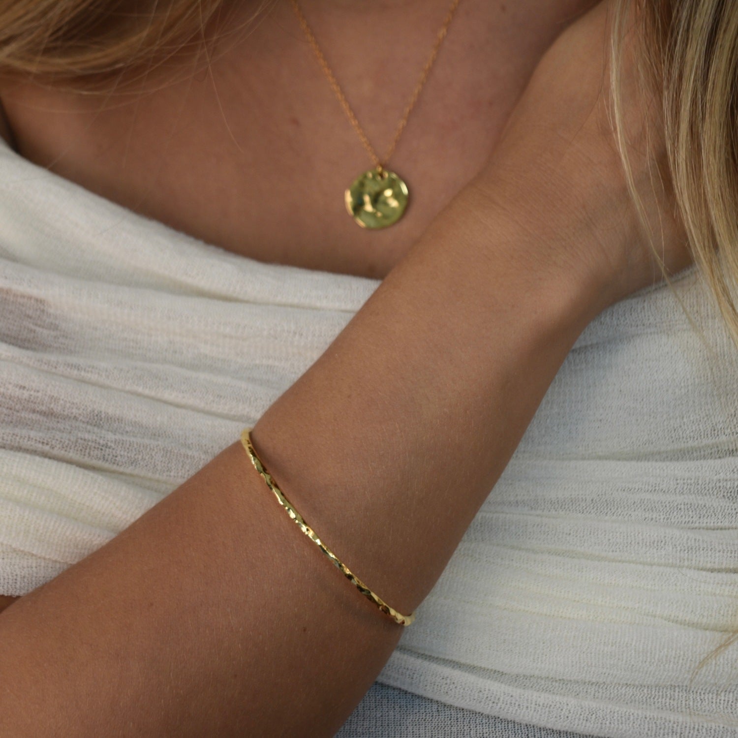 Hammered Bangle with an organic textured finish, available in sterling silver, gold vermeil and rose gold vermeil.