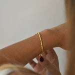 Hammered Bangle with an organic textured finish, available in sterling silver, gold vermeil and rose gold vermeil.