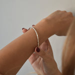 Hammered Bangle with an organic textured finish, available in sterling silver, gold vermeil and rose gold vermeil.