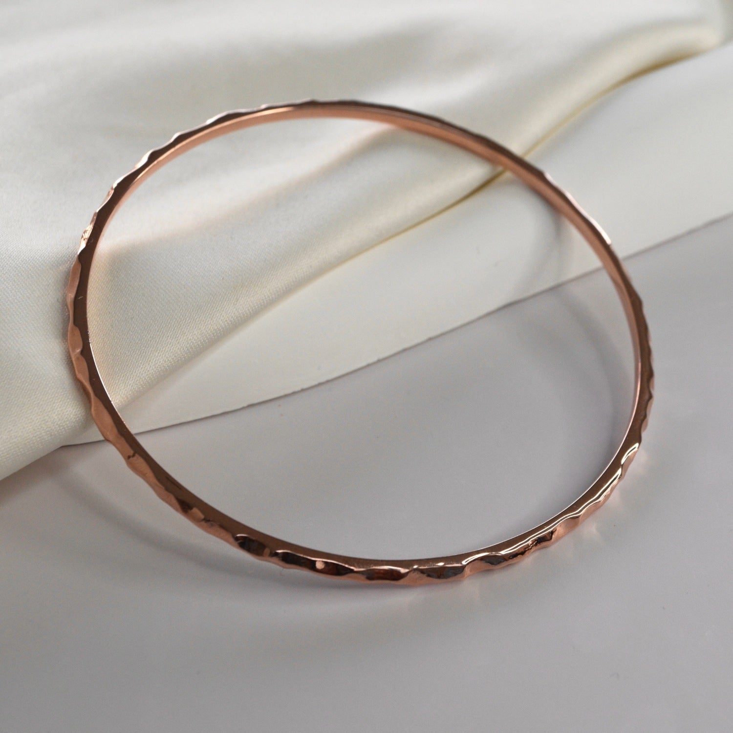 Hammered Bangle with an organic textured finish, available in sterling silver, gold vermeil and rose gold vermeil.