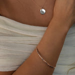 Hammered Bangle with an organic textured finish, available in sterling silver, gold vermeil and rose gold vermeil.