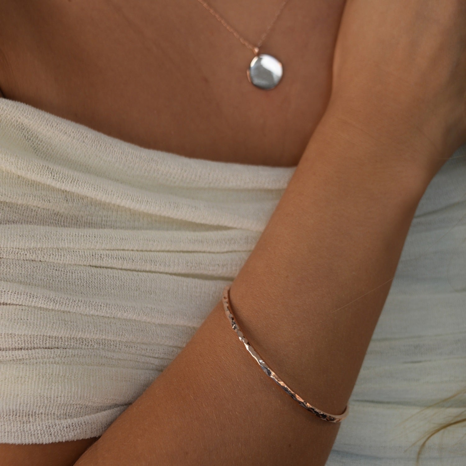 Hammered Bangle with an organic textured finish, available in sterling silver, gold vermeil and rose gold vermeil.