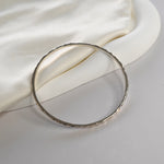 Hammered Bangle with an organic textured finish, available in sterling silver, gold vermeil and rose gold vermeil.