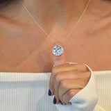 Hammered Disc Pendant Necklace with a textured circular pendant on a delicate chain.