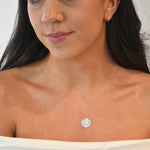 Hammered Disc Pendant Necklace with a textured circular pendant on a delicate chain.
