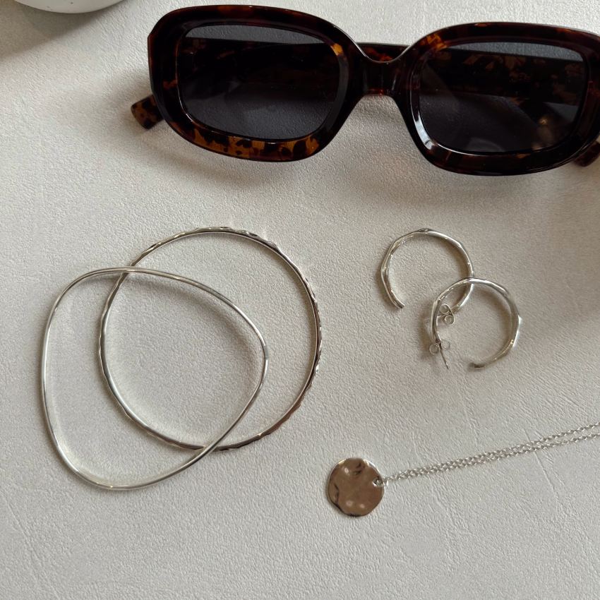Angled Hoop Earrings with a softly sculpted organic silhouette, available in sterling silver, gold vermeil and rose gold vermeil.