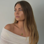 Hammered Disc Pendant Necklace with a textured circular pendant on a delicate chain.