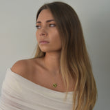 Hammered Disc Pendant Necklace with a textured circular pendant on a delicate chain.