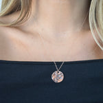 Hammered Disc Pendant Necklace with a textured circular pendant on a delicate chain.