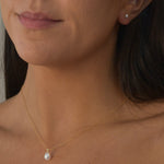 Ivory Pearl Stud Earrings featuring cultured freshwater pearls set in sterling silver.