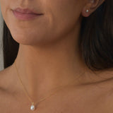 Ivory Pearl Stud Earrings featuring cultured freshwater pearls set in sterling silver.