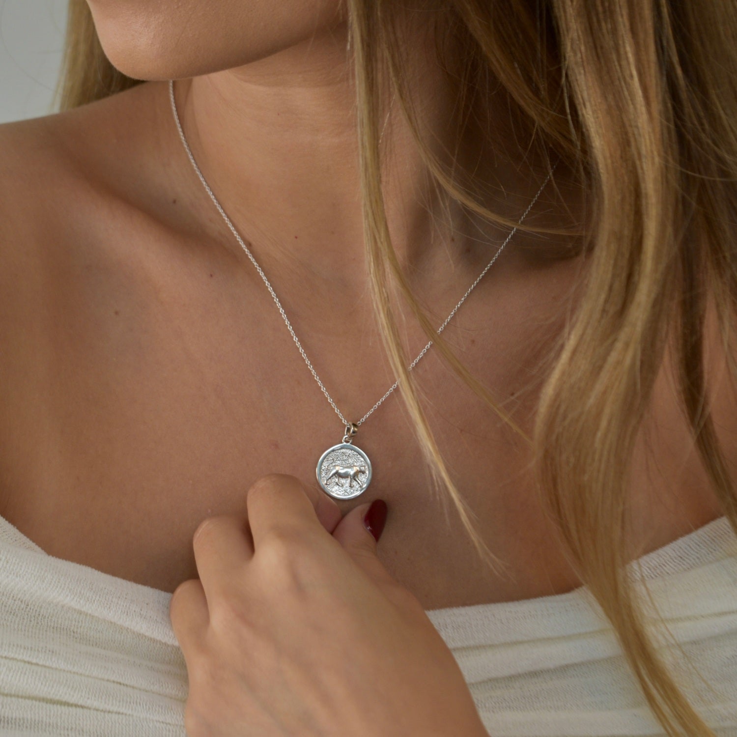 Lioness Pendant Necklace featuring a detailed lioness motif, available in gold vermeil and sterling silver.
