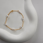 Nova Freshwater Ivory Pearl Bracelet featuring lustrous ivory freshwater pearls on a delicate gold vermeil chain.