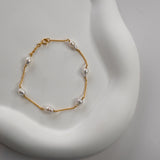 Nova Freshwater Ivory Pearl Bracelet featuring lustrous ivory freshwater pearls on a delicate gold vermeil chain.
