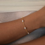 Nova Freshwater Ivory Pearl Bracelet featuring lustrous ivory freshwater pearls on a delicate gold vermeil chain.