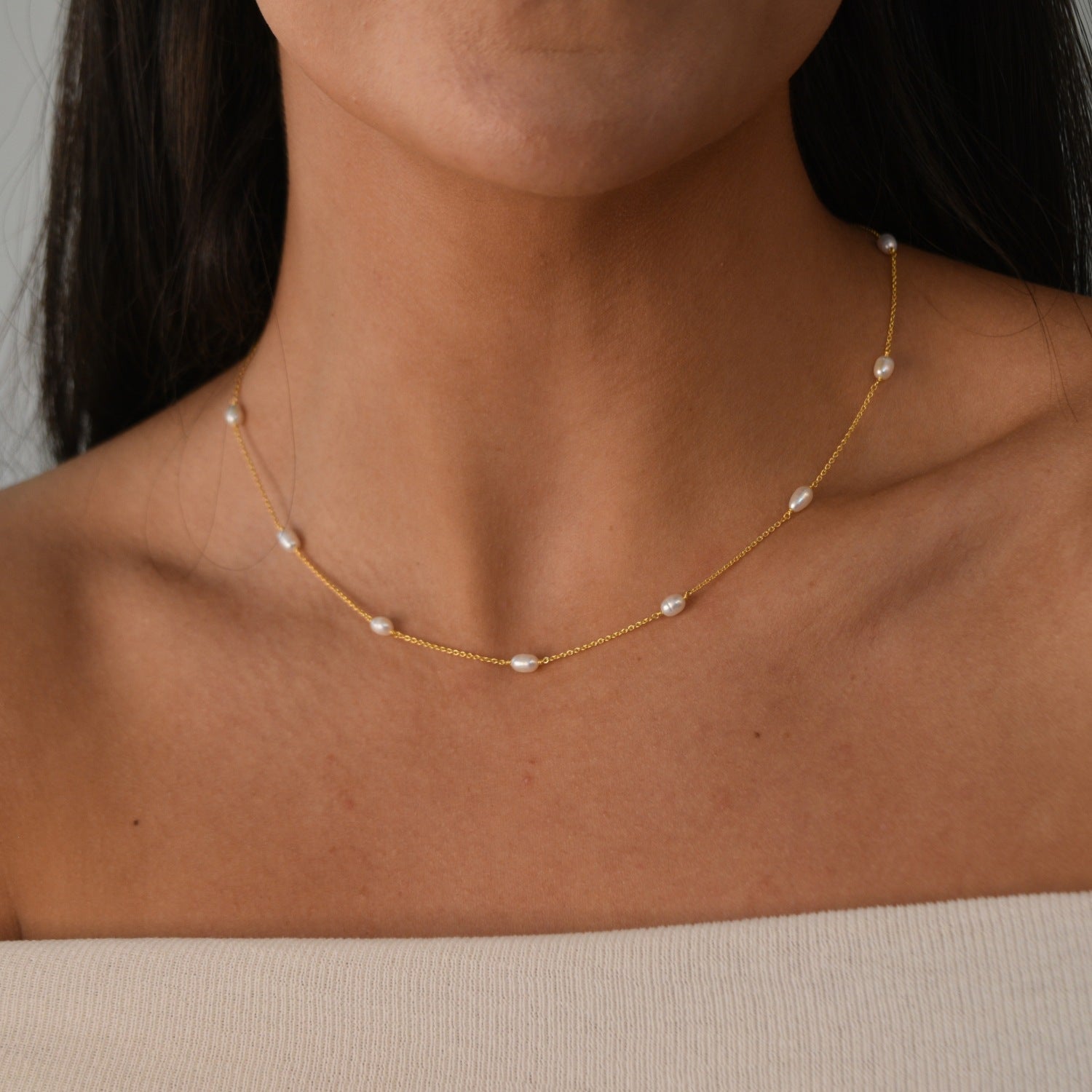 Nova Freshwater Ivory Pearl Necklace featuring lustrous freshwater pearls spaced along a delicate gold vermeil chain.
