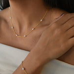 Nova Freshwater Ivory Pearl Necklace featuring lustrous freshwater pearls spaced along a delicate gold vermeil chain.