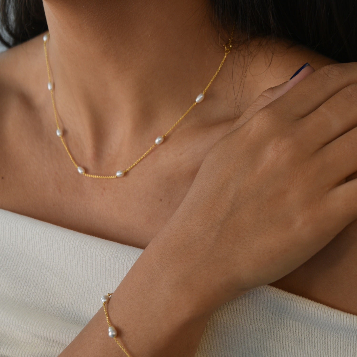 Nova Freshwater Ivory Pearl Necklace featuring lustrous freshwater pearls spaced along a delicate gold vermeil chain.