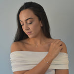 Nova Freshwater Ivory Pearl Necklace featuring lustrous freshwater pearls spaced along a delicate gold vermeil chain. 