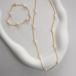 Nova Freshwater Ivory Pearl Necklace featuring lustrous freshwater pearls spaced along a delicate gold vermeil chain.