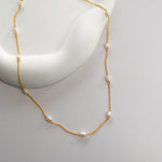 Nova Freshwater Ivory Pearl Necklace featuring lustrous freshwater pearls spaced along a delicate gold vermeil chain.