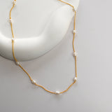 Nova Freshwater Ivory Pearl Necklace featuring lustrous freshwater pearls spaced along a delicate gold vermeil chain.