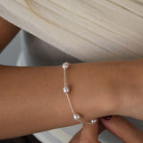 Pink pearl bracelet with blush pink freshwater pearls set along a delicate sterling silver chain.