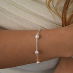 Pink pearl bracelet with blush pink freshwater pearls set along a delicate sterling silver chain.