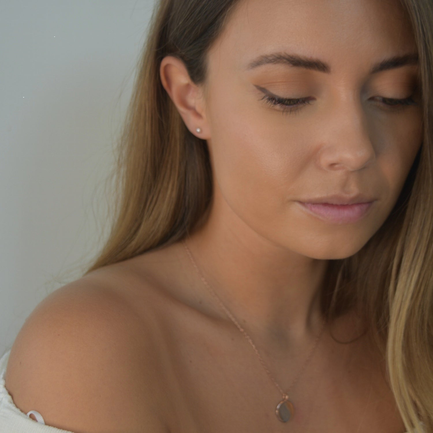 Pink Pearl Stud Earrings featuring cultured freshwater pearls set in sterling silver.
