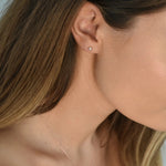 Pink Pearl Stud Earrings featuring cultured freshwater pearls set in sterling silver.