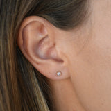 Pink Pearl Stud Earrings featuring cultured freshwater pearls set in sterling silver.
