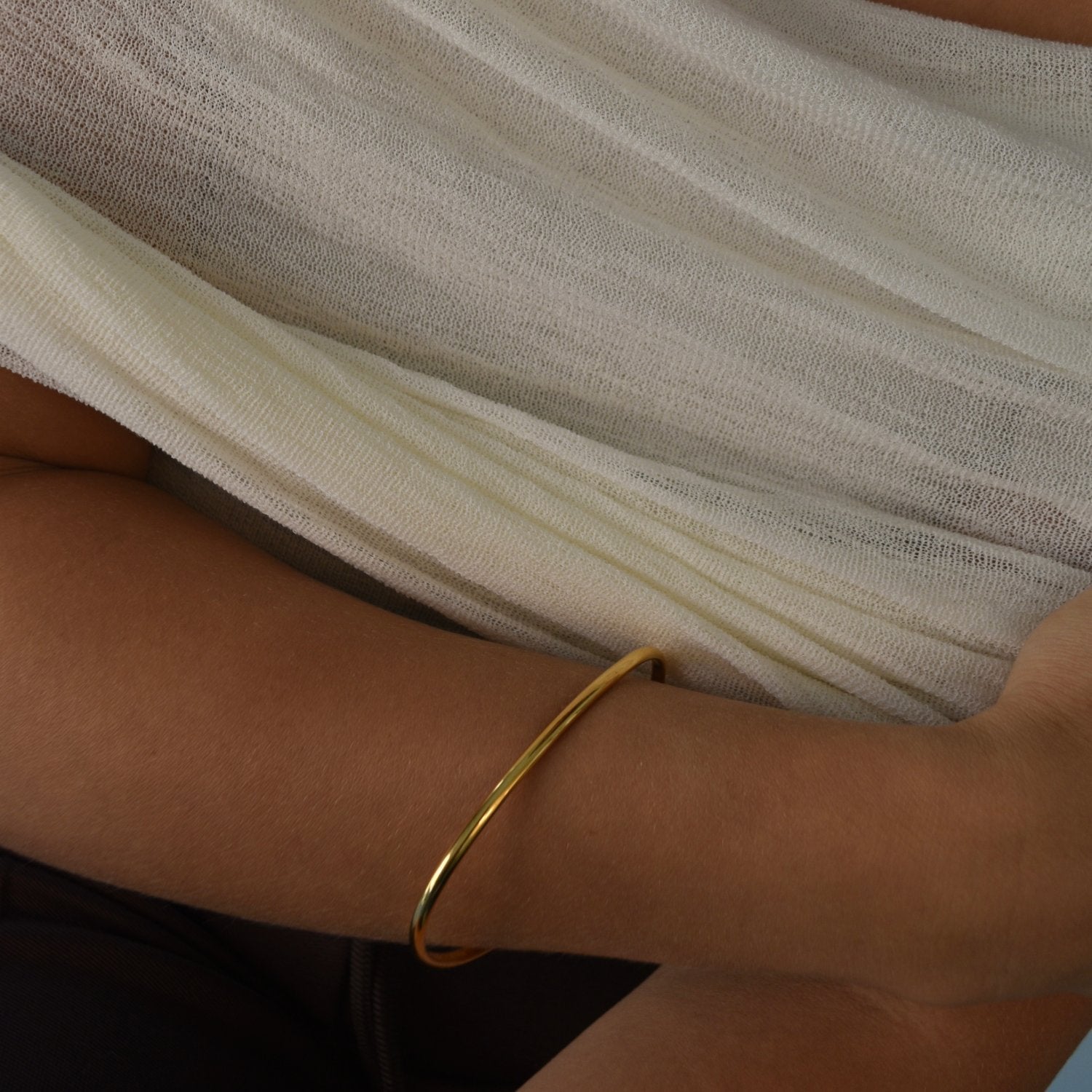 Signature Bangle with a softly sculpted organic silhouette, available in sterling silver, gold vermeil and rose gold vermeil.