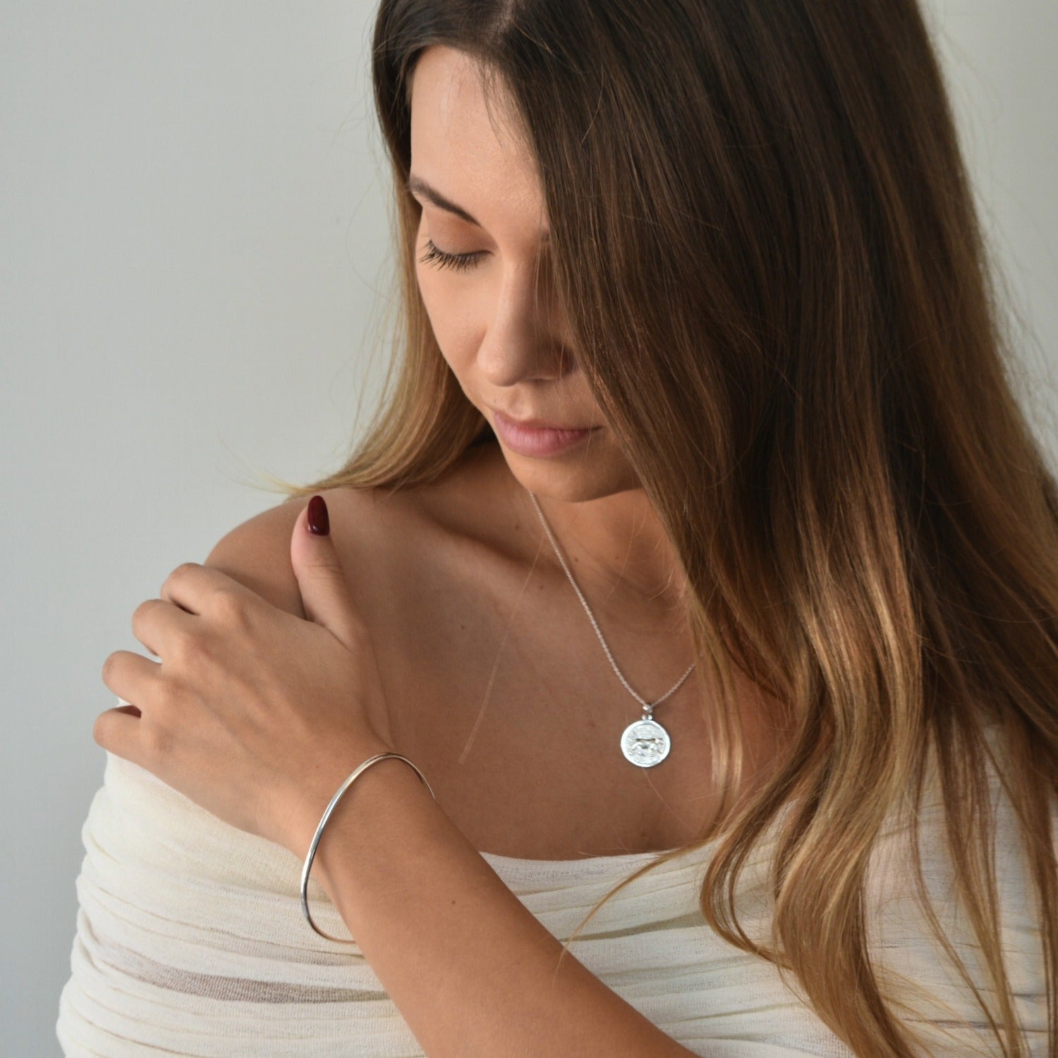 Signature Bangle with a softly sculpted organic silhouette, available in sterling silver, gold vermeil and rose gold vermeil.