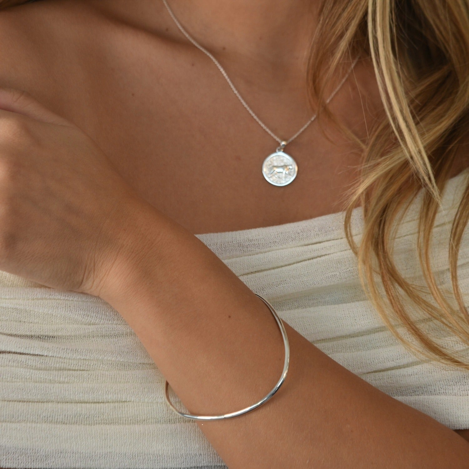 Signature Bangle with a softly sculpted organic silhouette, available in sterling silver, gold vermeil and rose gold vermeil.