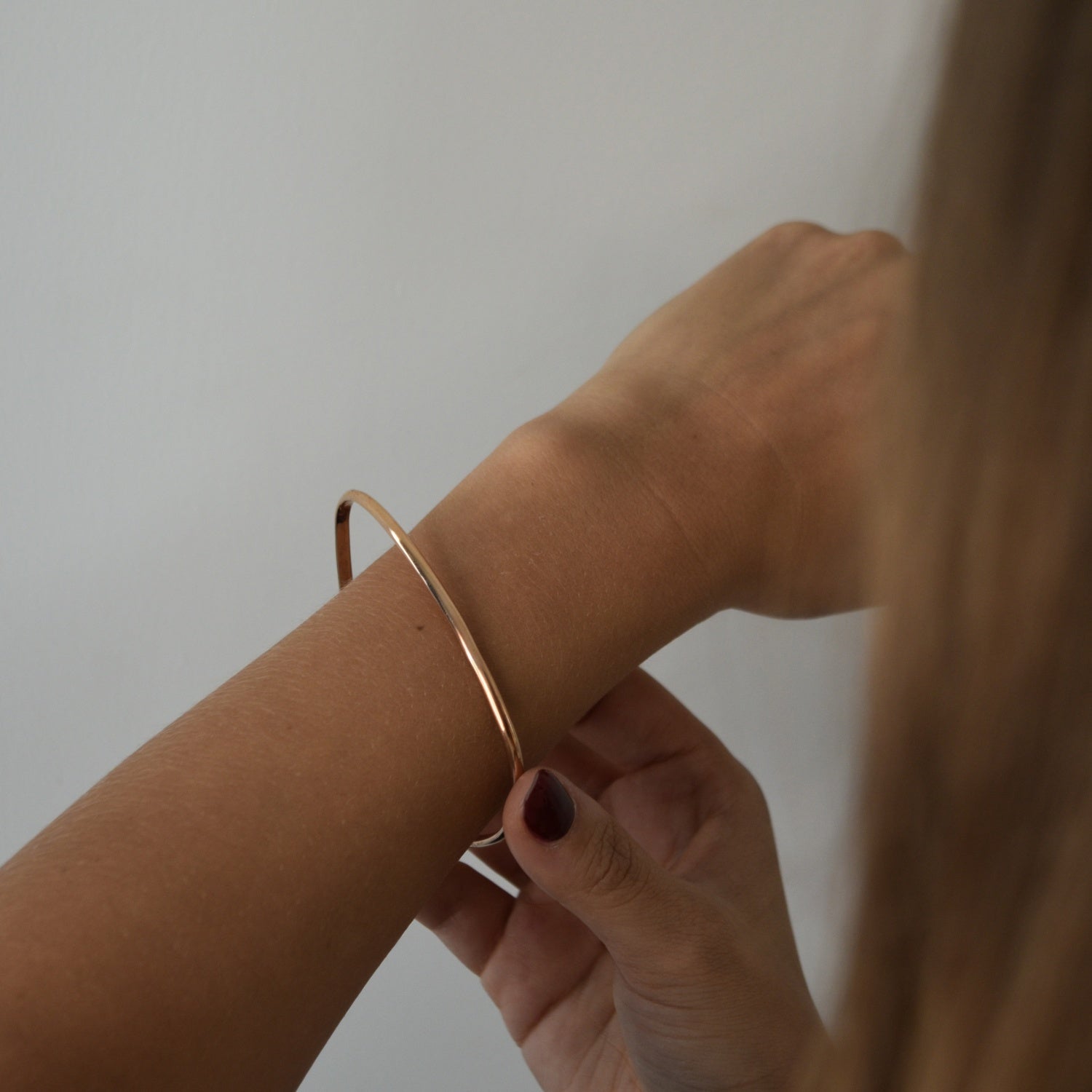 Signature Bangle with a softly sculpted organic silhouette, available in sterling silver, gold vermeil and rose gold vermeil.